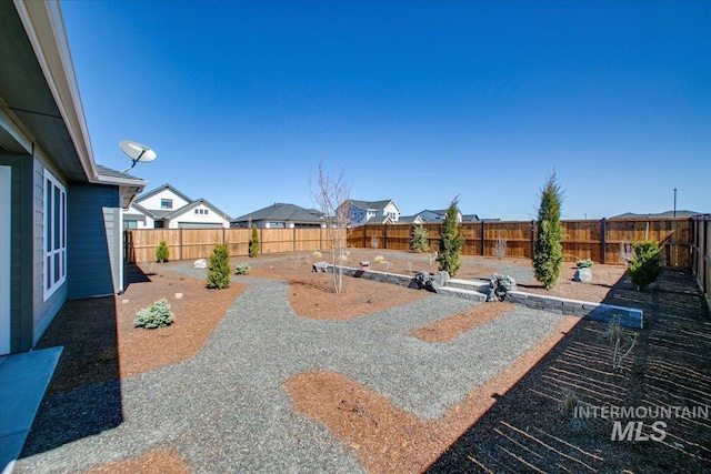 view of yard featuring a fenced backyard and a patio area