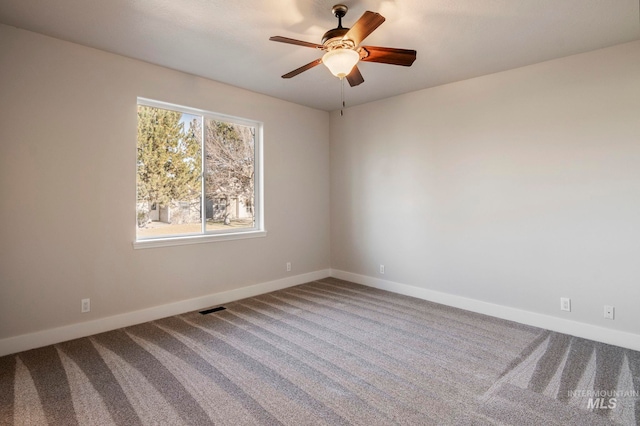 spare room with carpet flooring and ceiling fan