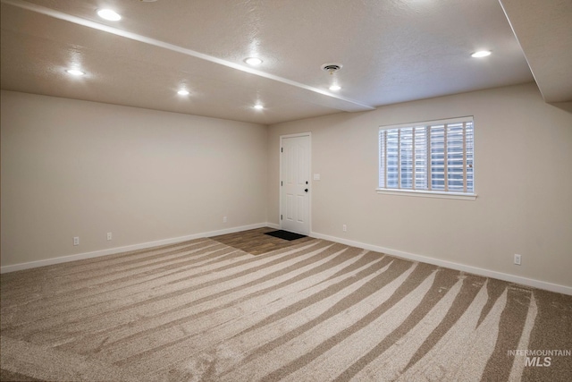 spare room with light colored carpet