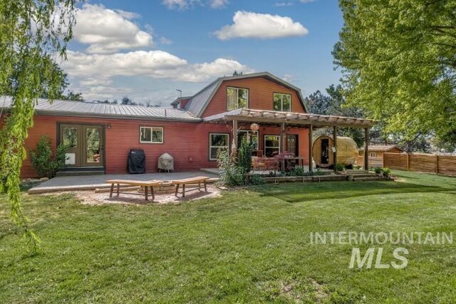 4610 Power Rd, Ontario, OR 97914 - rear view of house with a patio area, french doors, a gambrel roof, and metal roof