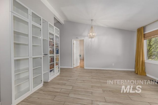 4610 Power Rd, Ontario, OR 97914 - empty room featuring a chandelier, wood finished floors, and baseboards