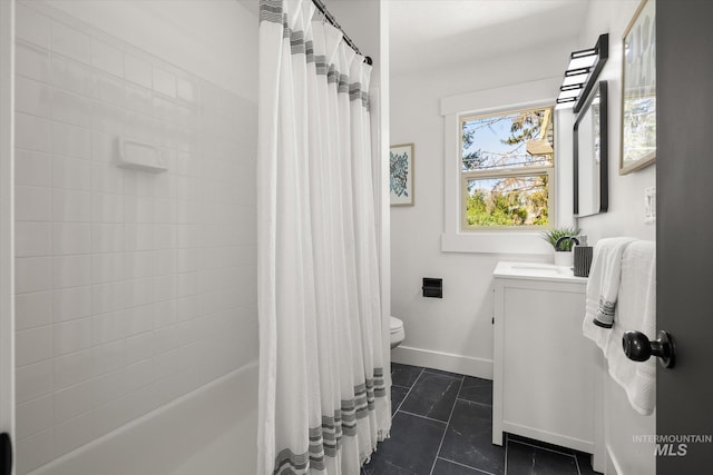 full bathroom with toilet, vanity, tile patterned flooring, baseboards, and shower / tub combo