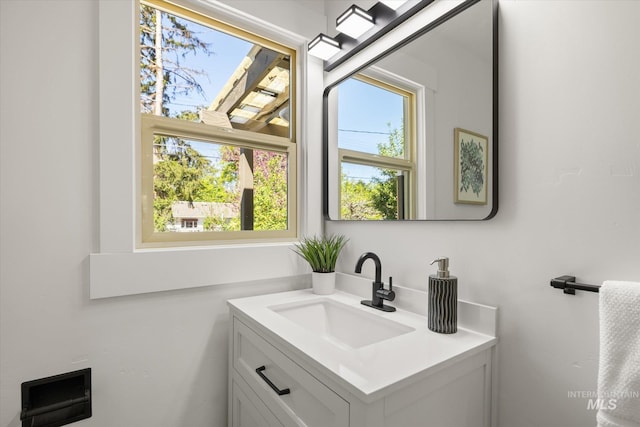 bathroom featuring healthy amount of natural light and vanity