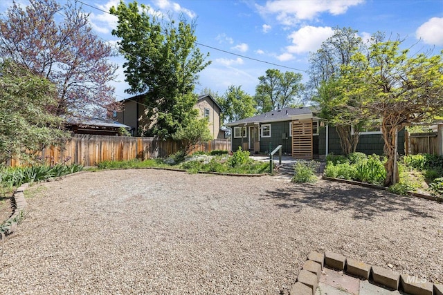 back of house featuring a fenced backyard and a patio