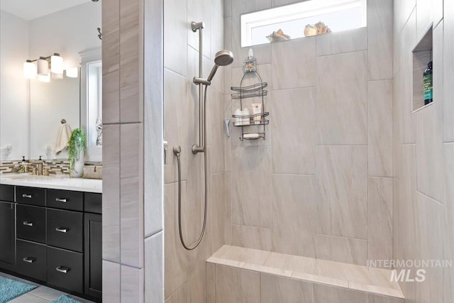 full bathroom with vanity and a walk in shower