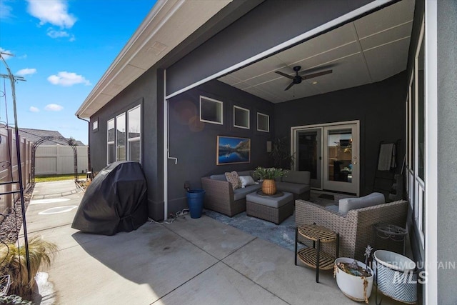 view of patio featuring fence, an outdoor hangout area, a ceiling fan, and area for grilling