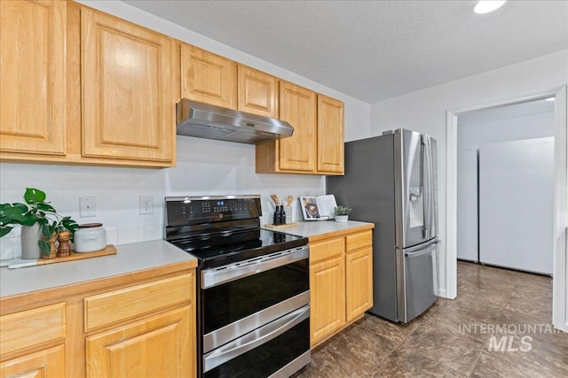 kitchen featuring under cabinet range hood, appliances with stainless steel finishes, light brown cabinetry, and light countertops