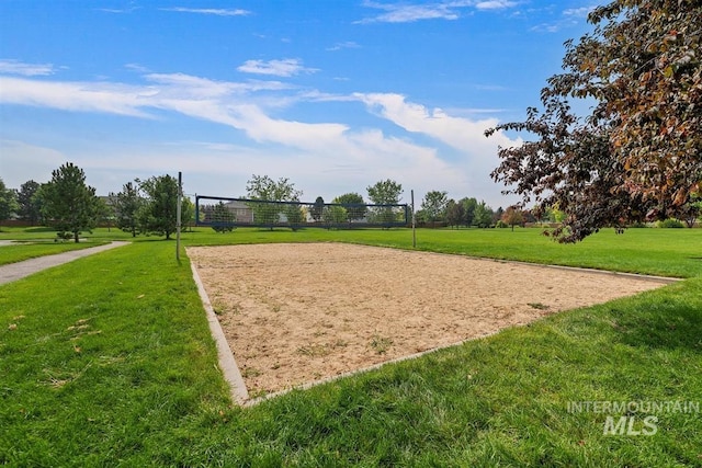 view of home's community with a lawn and volleyball court