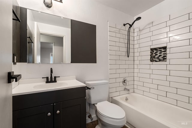 full bathroom featuring vanity, toilet, and tiled shower / bath