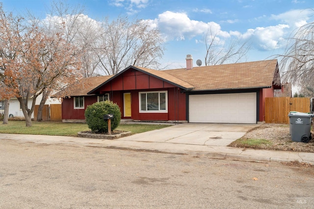 ranch-style home with a garage and a front lawn