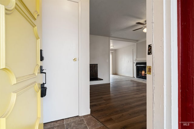 hallway with dark hardwood / wood-style flooring