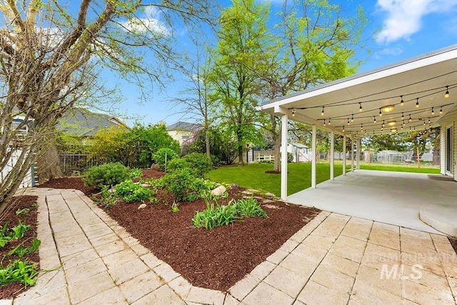 view of yard with fence and a patio area
