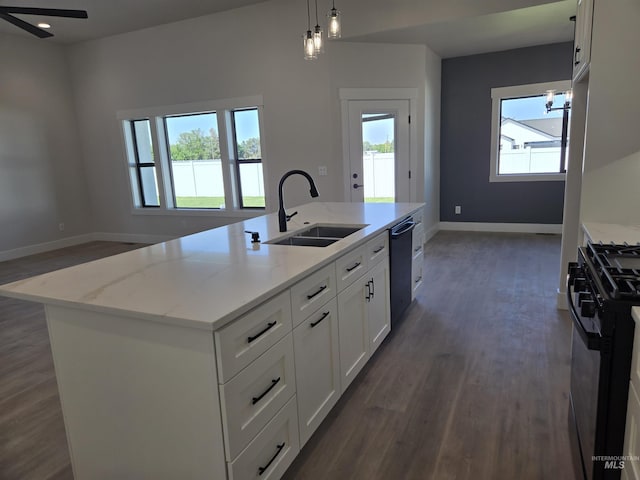 531 Full Moon Way, Twin Falls, ID 83301 - kitchen with black appliances, dark wood-style flooring, healthy amount of natural light, and a center island with sink