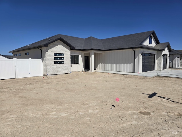 531 Full Moon Way, Twin Falls, ID 83301 - view of front facade with an attached garage, board and batten siding, and driveway