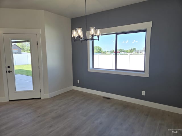 531 Full Moon Way, Twin Falls, ID 83301 - unfurnished dining area with a chandelier and wood finished floors