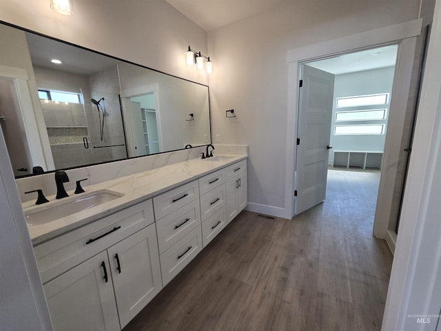 531 Full Moon Way, Twin Falls, ID 83301 - full bath featuring double vanity, wood finished floors, and a tile shower