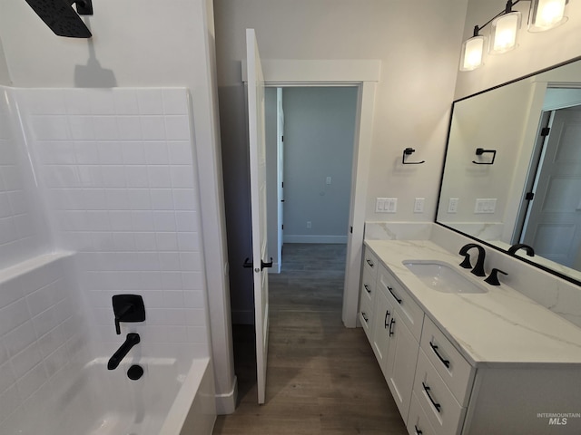 531 Full Moon Way, Twin Falls, ID 83301 - bathroom featuring wood finished floors, vanity, and washtub / shower combination