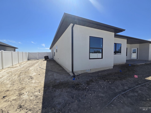 531 Full Moon Way, Twin Falls, ID 83301 - back of property with a gate and stucco siding