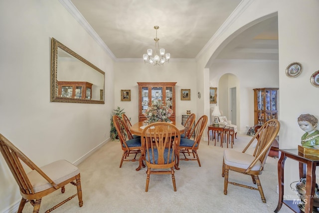 carpeted dining room featuring crown molding and a notable chandelier