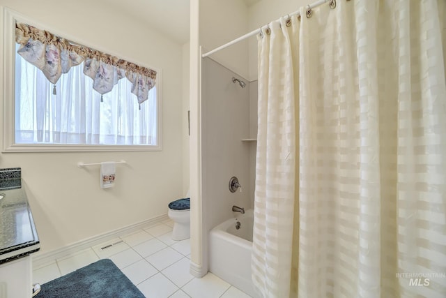 bathroom with toilet, tile patterned floors, and shower / bath combo with shower curtain