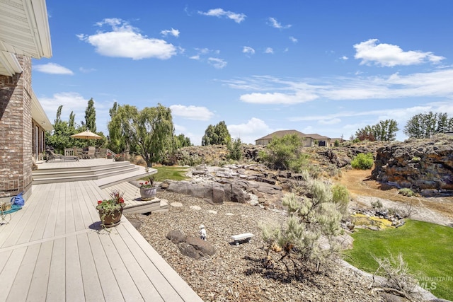 view of yard featuring a wooden deck