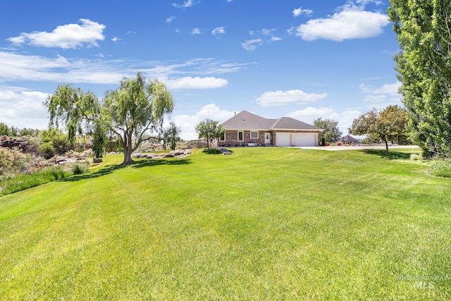 view of yard featuring a garage