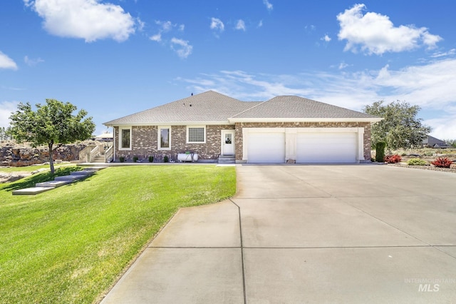 view of front of home featuring a front lawn and a garage