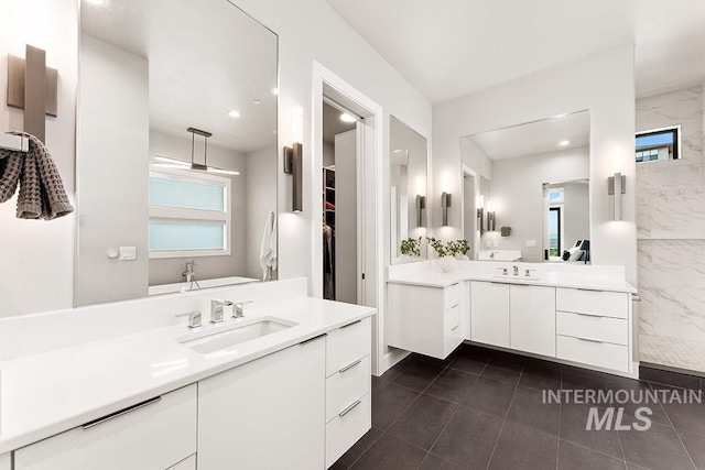 1519 S Galaxy Way, Boise, ID 83712 - bathroom with two vanities, recessed lighting, and tile patterned floors