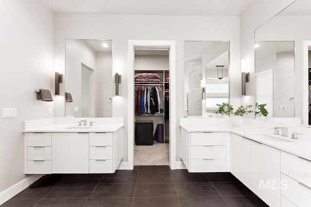 1519 S Galaxy Way, Boise, ID 83712 - bathroom featuring two vanities, tile patterned floors, and a spacious closet