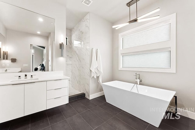 1519 S Galaxy Way, Boise, ID 83712 - bathroom with a freestanding bath, vanity, a marble finish shower, recessed lighting, and tile patterned flooring