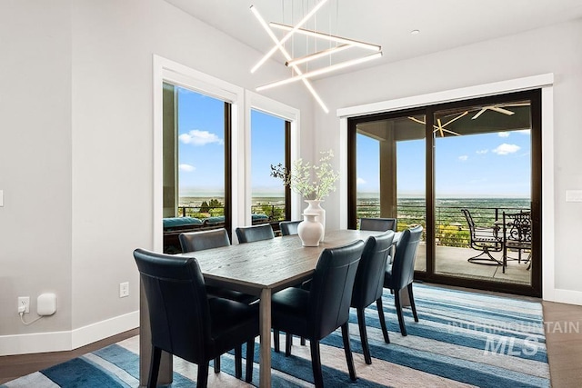 1519 S Galaxy Way, Boise, ID 83712 - dining space featuring baseboards and wood finished floors