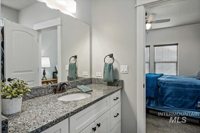 bathroom featuring vanity and ceiling fan