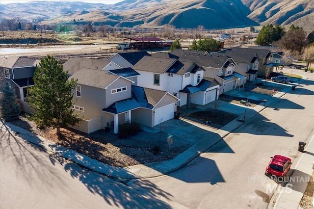 birds eye view of property with a mountain view