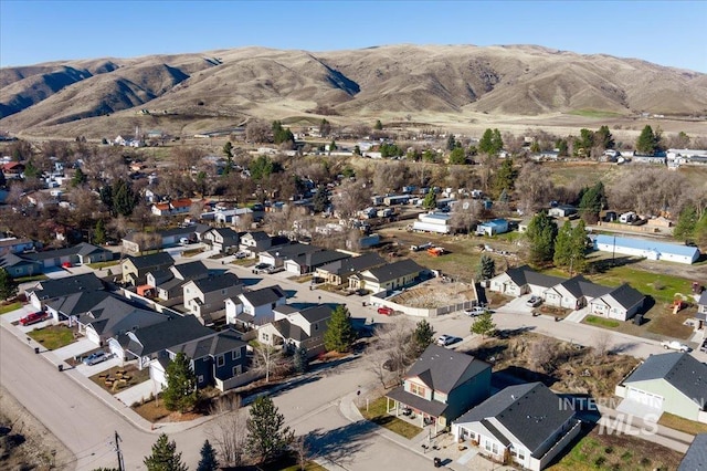 birds eye view of property featuring a mountain view