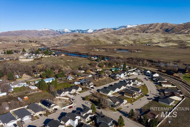 drone / aerial view featuring a mountain view