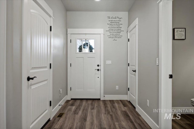 interior space with dark hardwood / wood-style floors