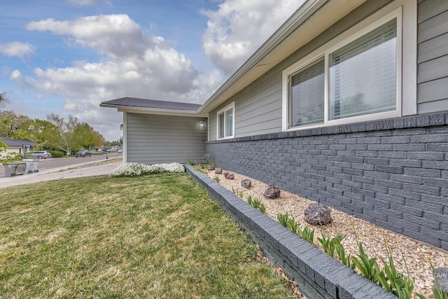 view of home's exterior featuring a lawn