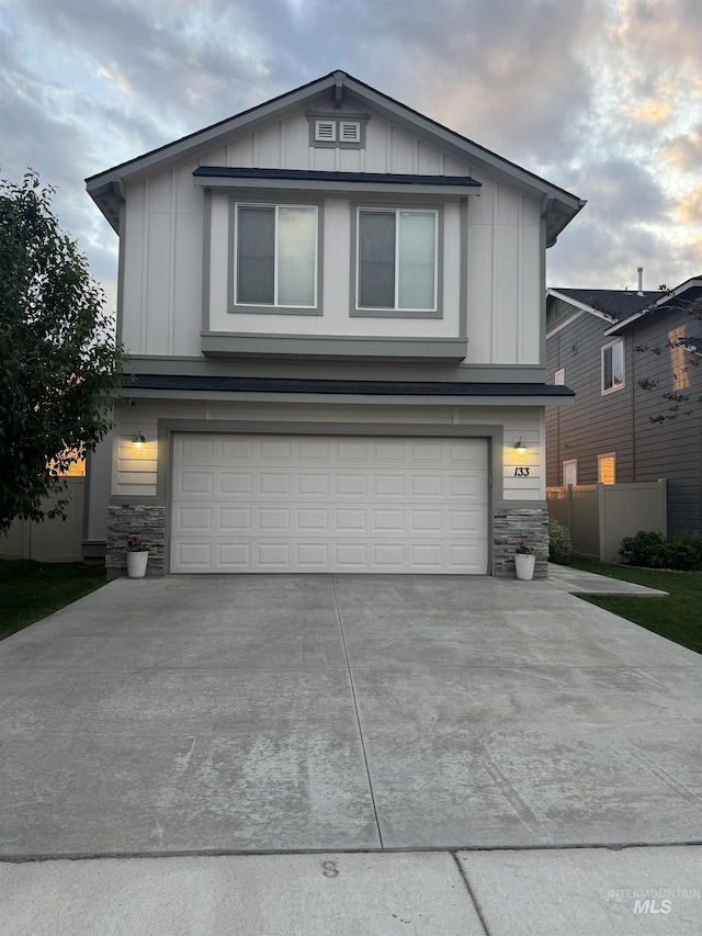 133 S Baraya Way, Meridian, ID 83642 - view of front facade with board and batten siding, stone siding, and a garage