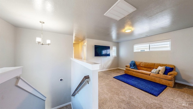 133 S Baraya Way, Meridian, ID 83642 - living room featuring carpet, baseboards, and a chandelier