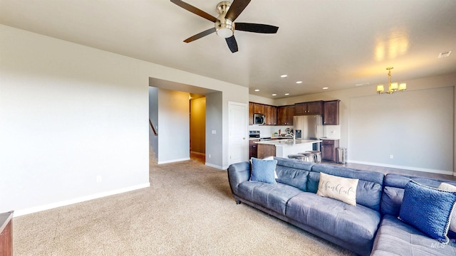 133 S Baraya Way, Meridian, ID 83642 - living room with baseboards, light colored carpet, a chandelier, ceiling fan, and recessed lighting