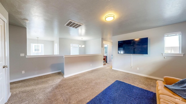 133 S Baraya Way, Meridian, ID 83642 - unfurnished living room with carpet floors and baseboards