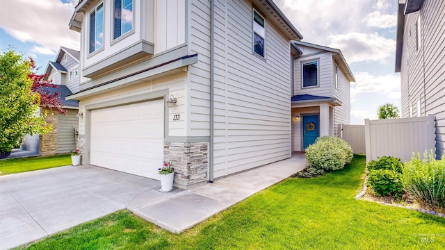 133 S Baraya Way, Meridian, ID 83642 - view of home's exterior with a garage, stone siding, board and batten siding, and concrete driveway