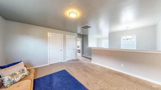 133 S Baraya Way, Meridian, ID 83642 - unfurnished room with light carpet, a chandelier, and baseboards