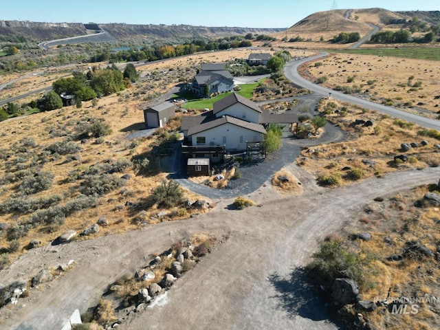 birds eye view of property with a rural view