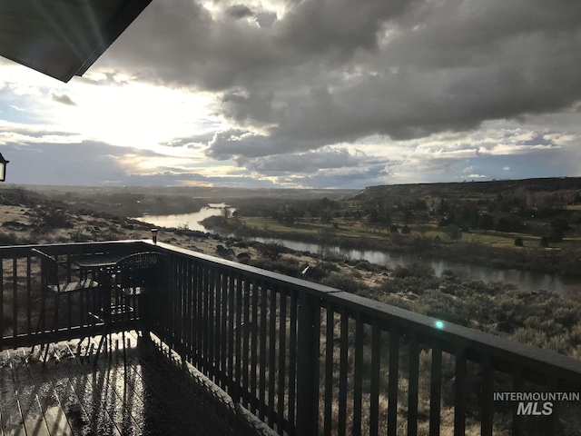 balcony featuring a water view