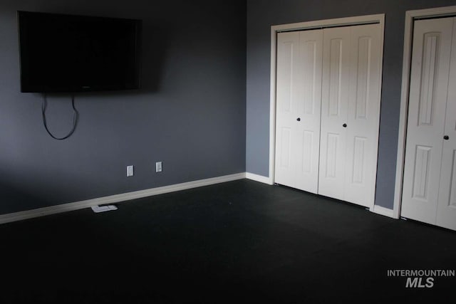 unfurnished bedroom featuring baseboards