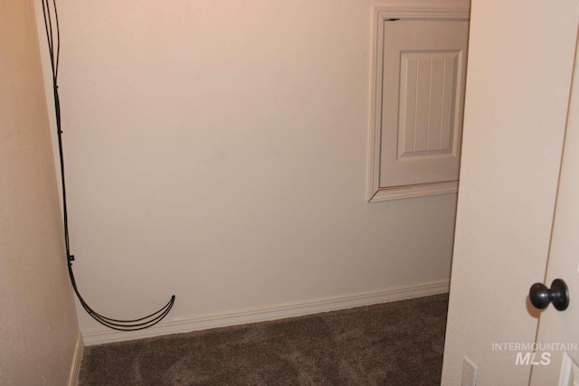 unfurnished room featuring baseboards and carpet flooring