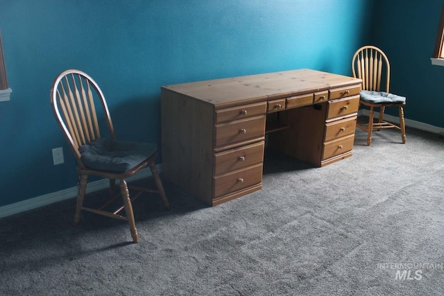 carpeted office space featuring baseboards