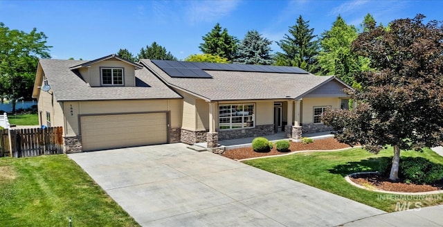 1563 W Colville Ct, Eagle, ID 83616 - craftsman house with stone siding, concrete driveway, a garage, and roof mounted solar panels