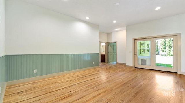1563 W Colville Ct, Eagle, ID 83616 - empty room featuring wood finished floors, wainscoting, and recessed lighting